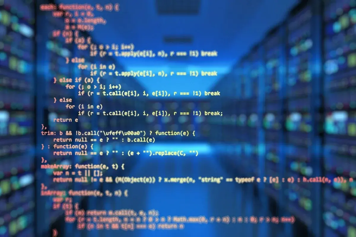 Source code displayed over a blurred data center with server racks.