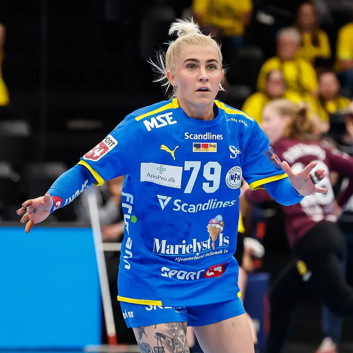 Handball player Kristina Kristiansen in blue jersey during a match