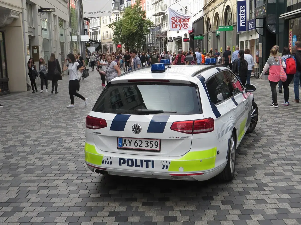 Danish police car on busy pedestrian street in Copenhagen